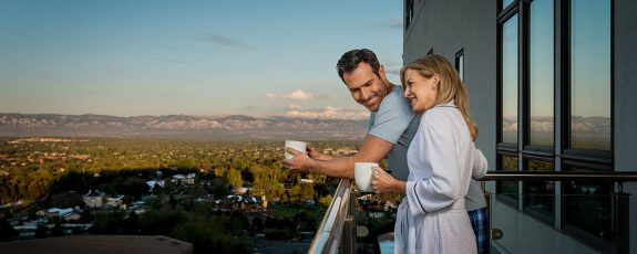 larlyn property management condo couple enjoying coffee on their balcony