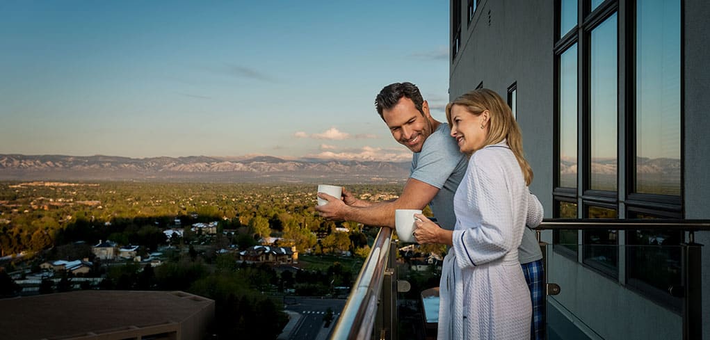 larlyn property management condo couple enjoying coffee on their balcony