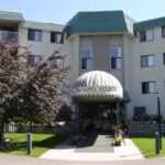 Entrance to Lord Nelson apartment building at 5125 Riverbend Road in Edmonton, Alberta.