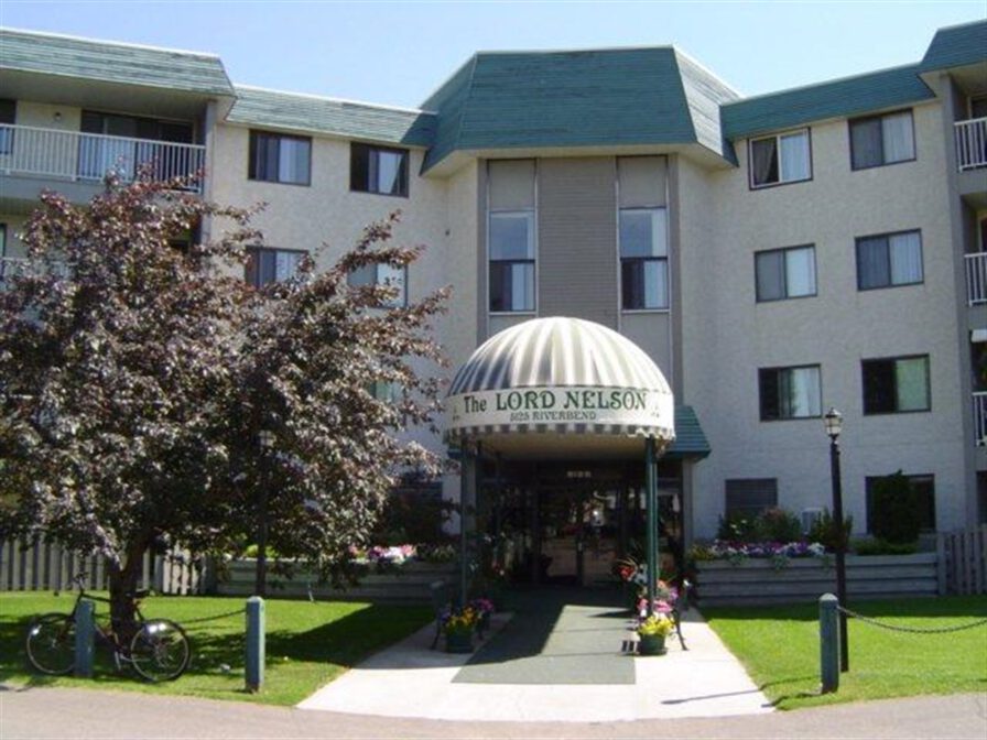 Entrance to Lord Nelson apartment building at 5125 Riverbend Road in Edmonton, Alberta.