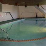 Spacious saltwater indoor pool at Lord Nelson apartment building.
