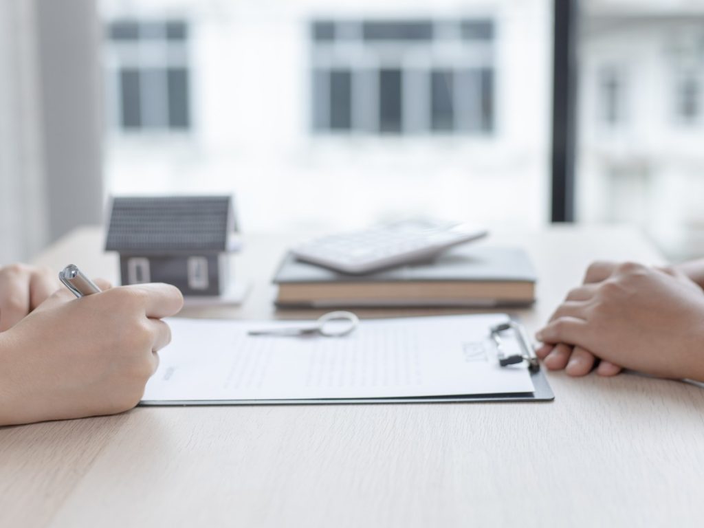 Landlord and tenant going over legal requirements for a rental agreement in Ontario.
